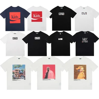 Eleven short sleeve tees arranged in rows, navy, black and white, each carrying a different chest print